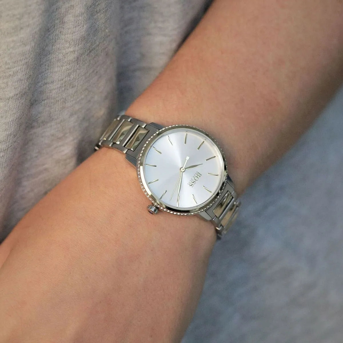 Hugo Boss Signature watch on-wrist lifestyle shot with two-tone strap and silver dial