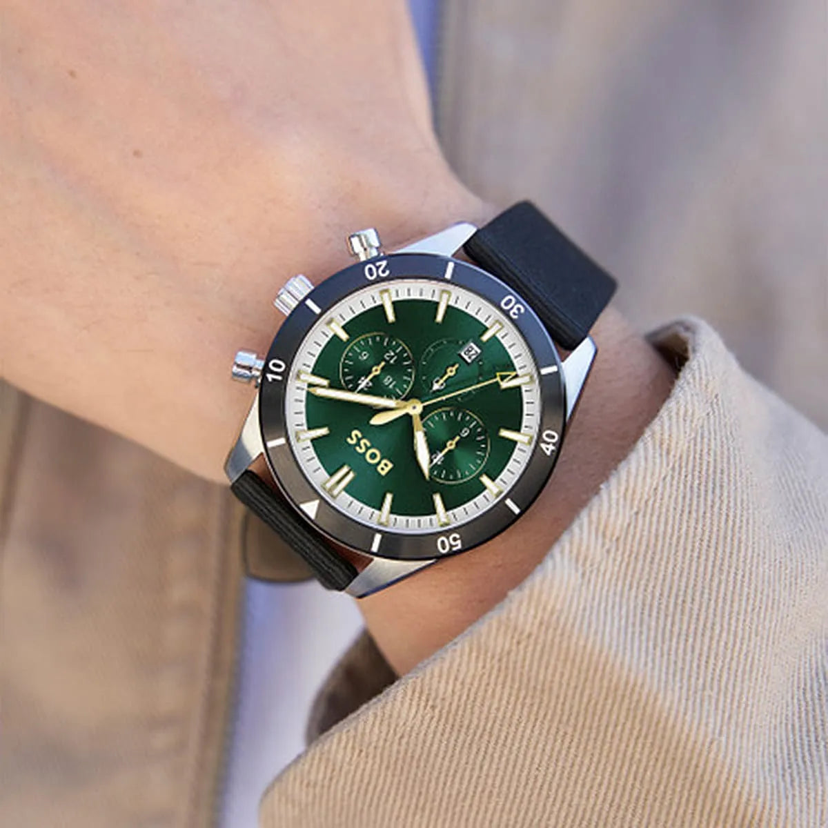 Hugo Boss Santiago chronograph watch worn on wrist showing green dial and black textile strap