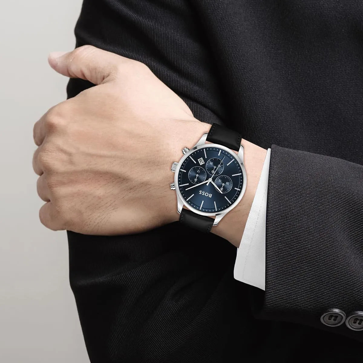 Hugo Boss Avery chronograph watch worn on wrist showing blue dial and black leather strap