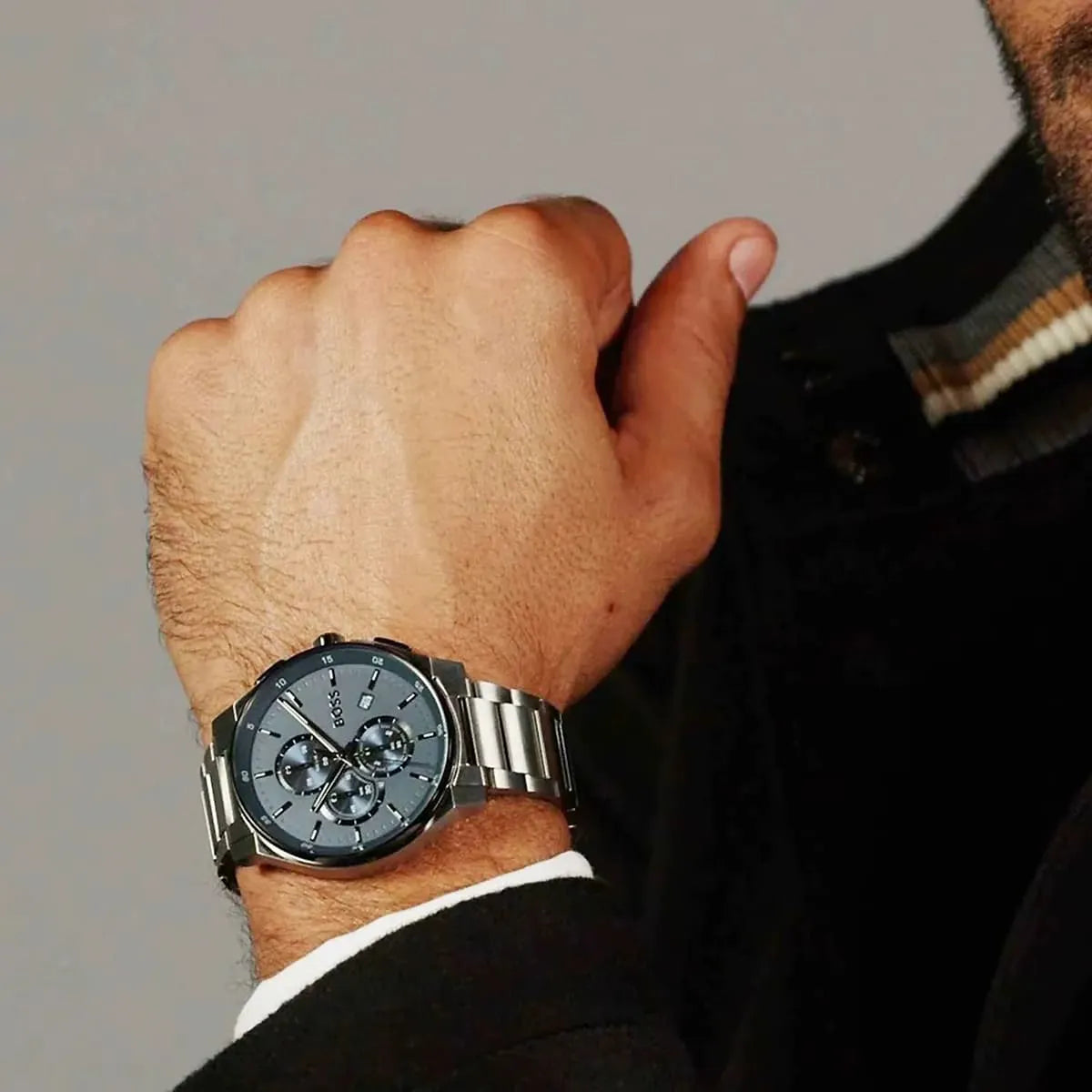 HUGO BOSS quartz chronograph watch worn on wrist, blue dial with silver case and bracelet