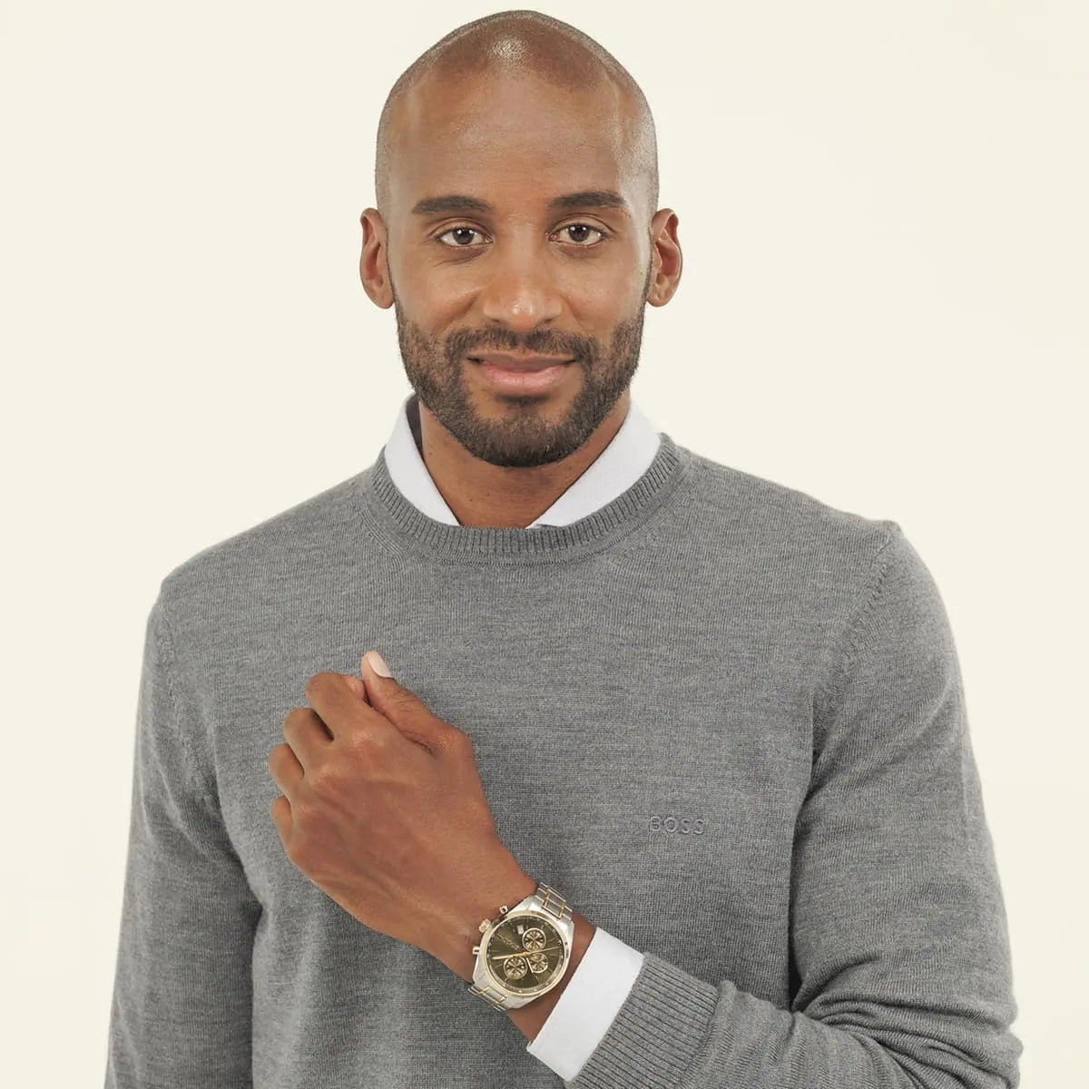 Hugo BOSS Grand Prix chronograph watch on wrist with two-tone bracelet and green dial