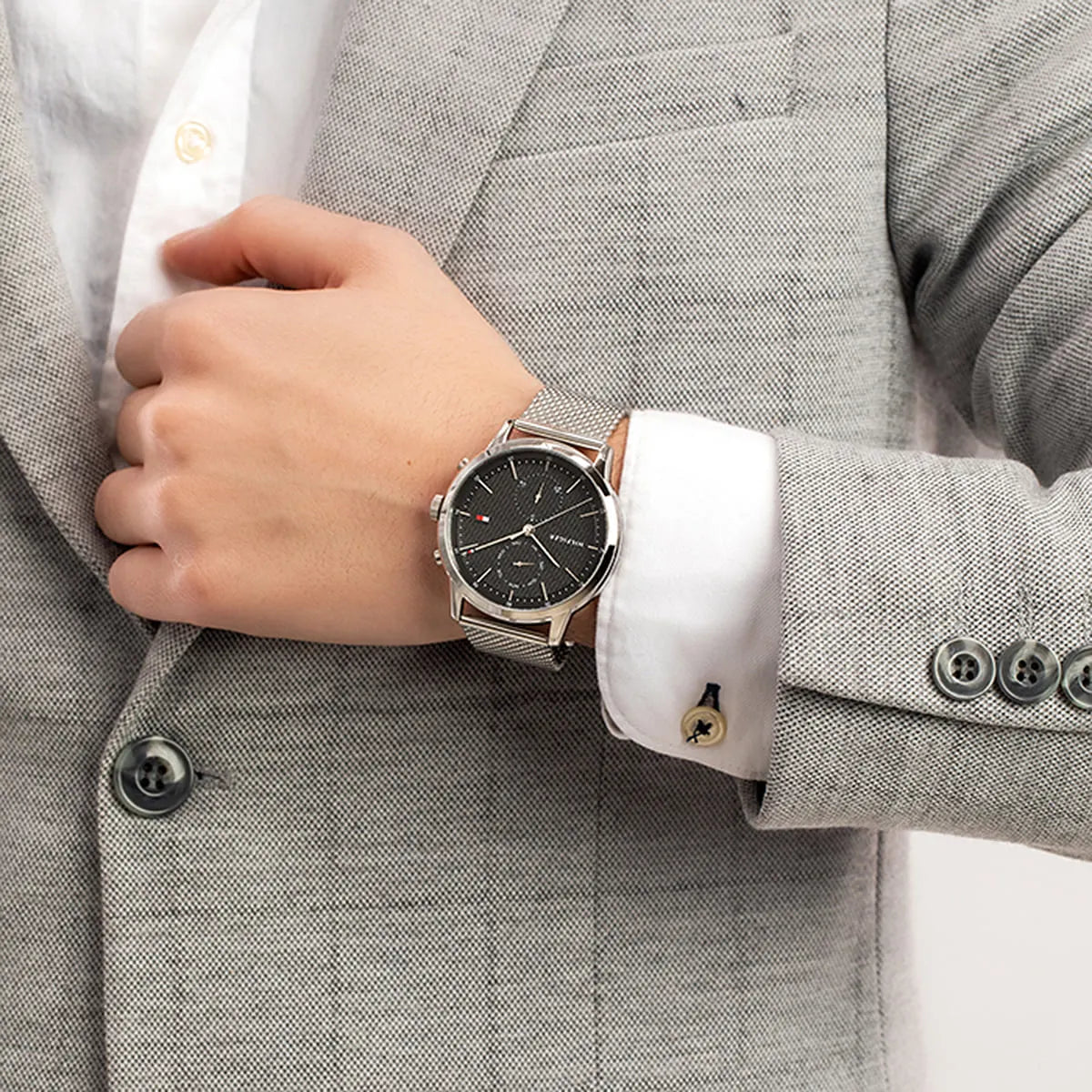 Tommy Hilfiger 1710433 watch worn with formal grey suit