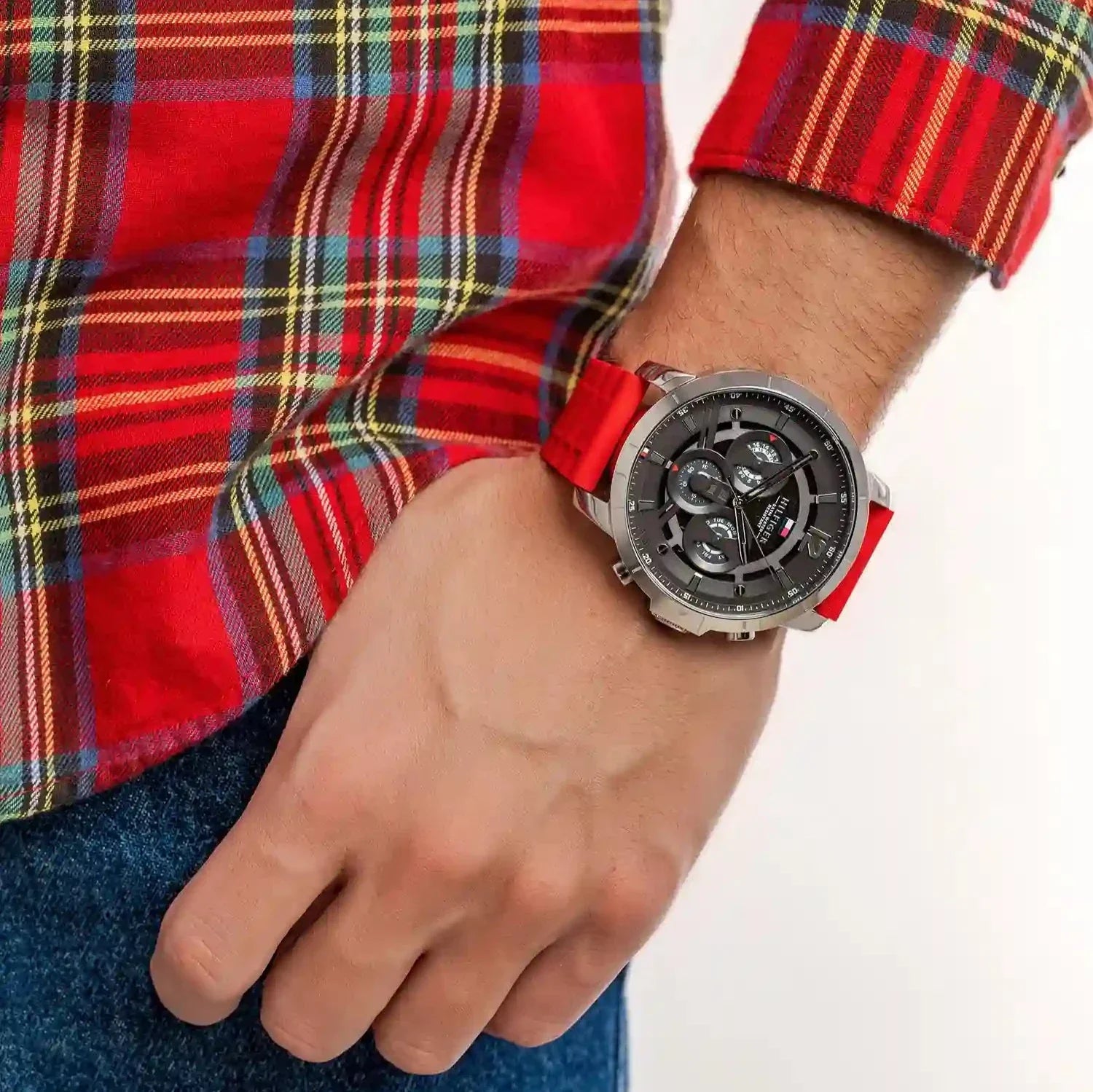 Tommy Hilfiger Luca watch worn on wrist with red strap