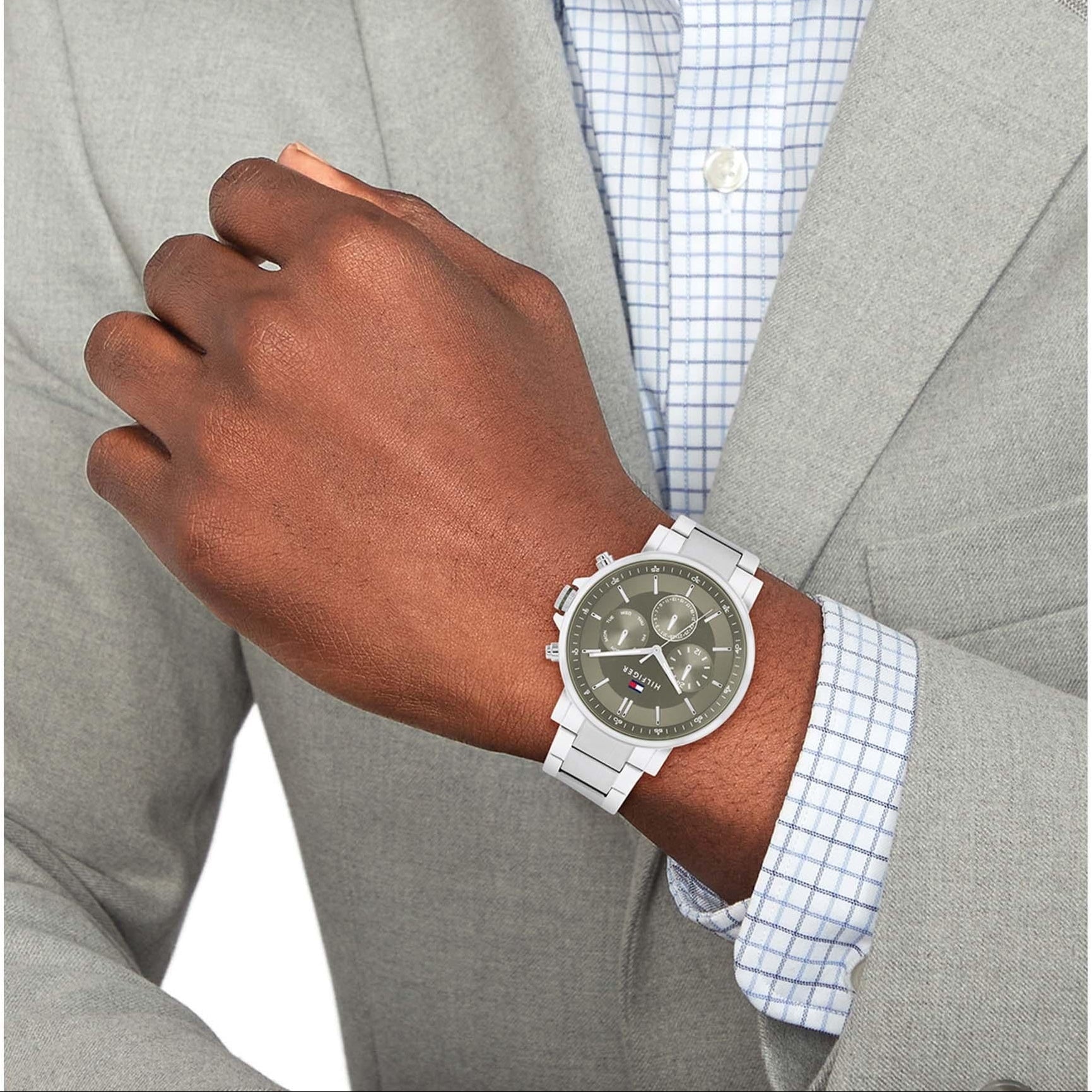 Tommy Hilfiger Tyson chronograph watch worn on wrist with green dial and silver strap