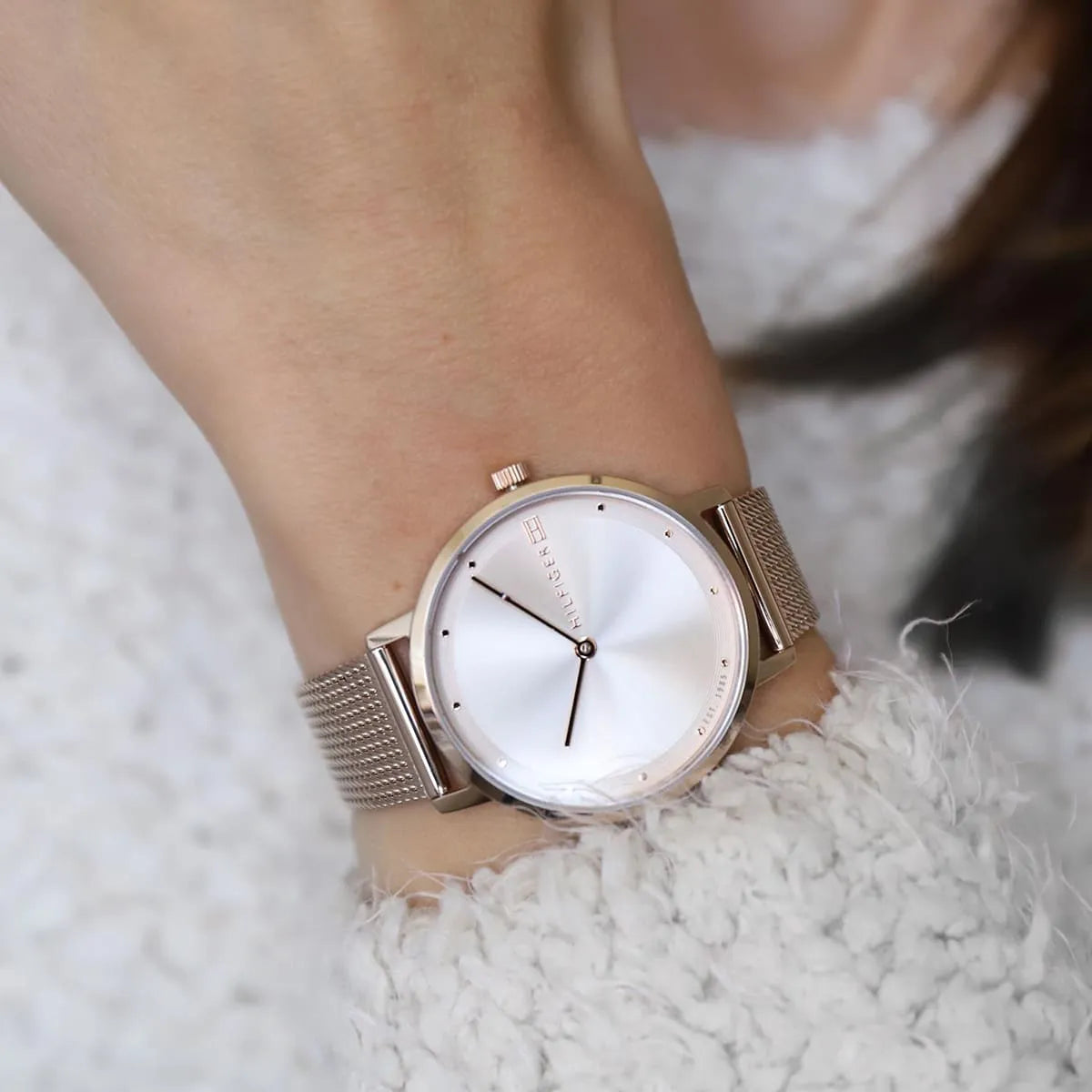 Tommy Hilfiger women's watch worn on wrist with mesh strap