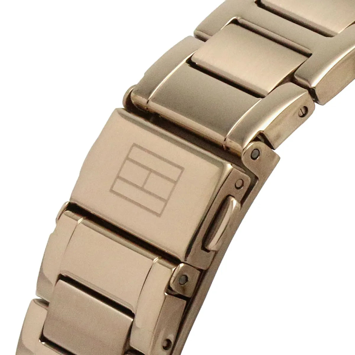 Close-up of rose gold metal bracelet links and fold-over clasp on Tommy Hilfiger Kennedy watch