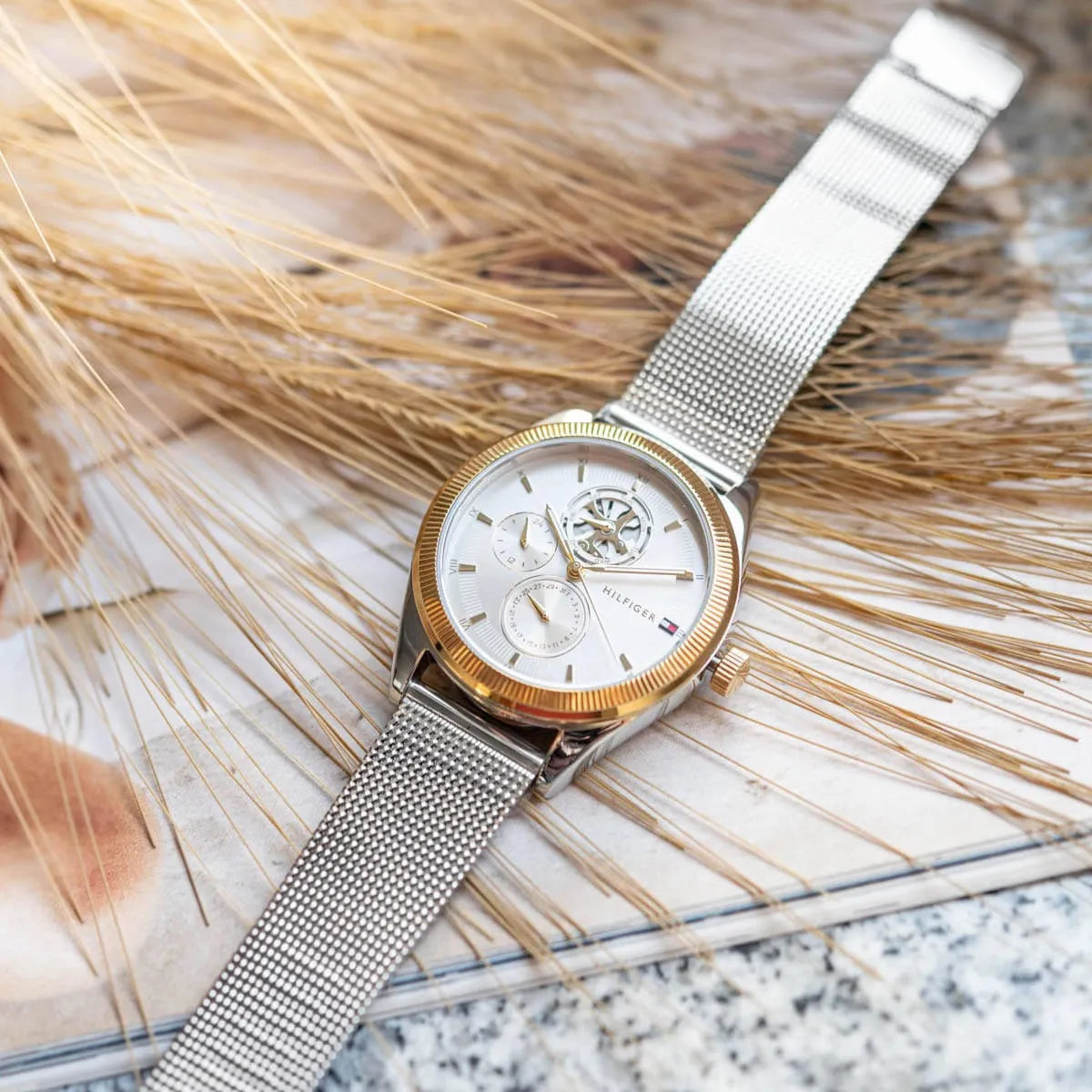 Tommy Hilfiger Monica watch worn on wrist with silver mesh strap