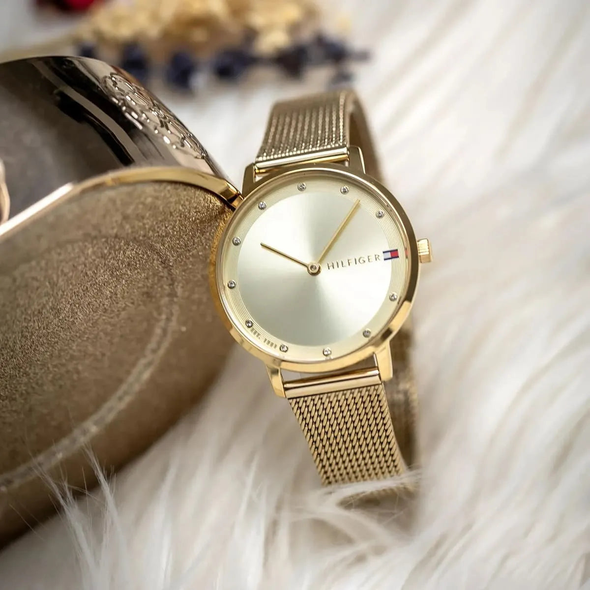Tommy Hilfiger Pippa gold watch on wrist in casual lifestyle photography