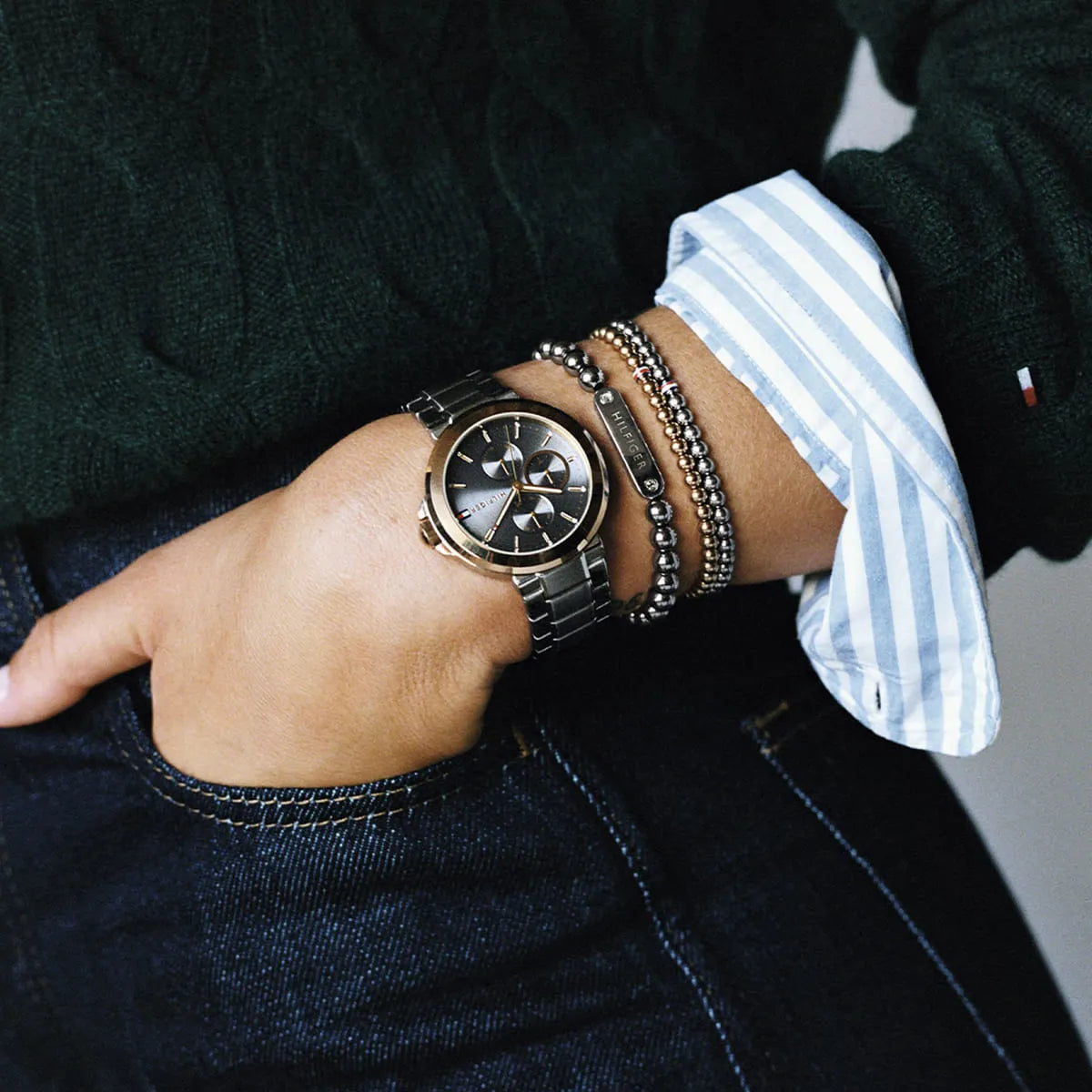 Tommy Hilfiger watch styled on wrist with accessories and business casual outfit
