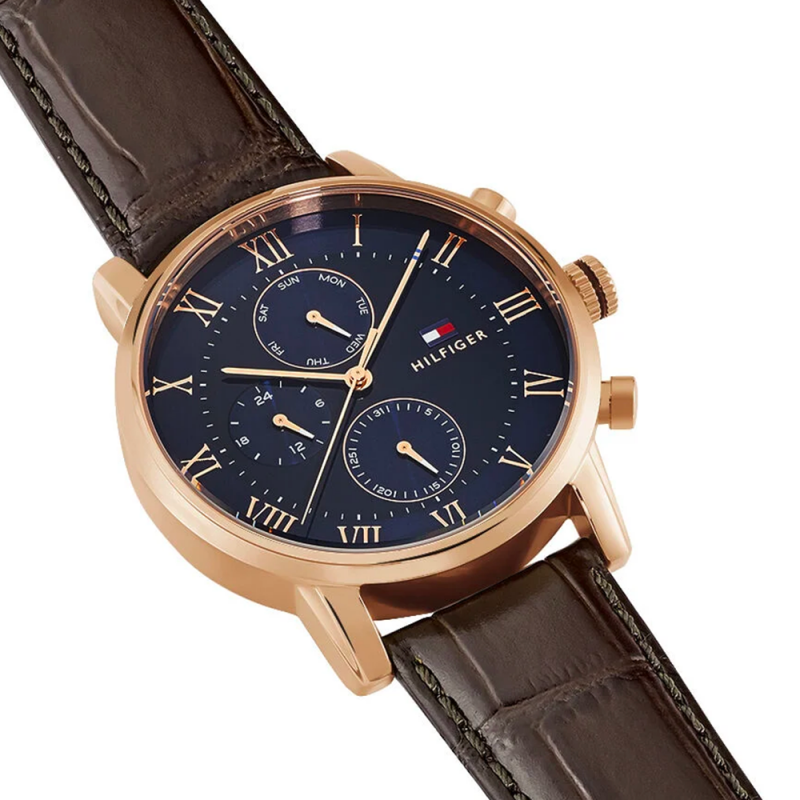 Tommy Hilfiger Kane watch on wrist showing blue dial with roman numerals and chronograph subdials