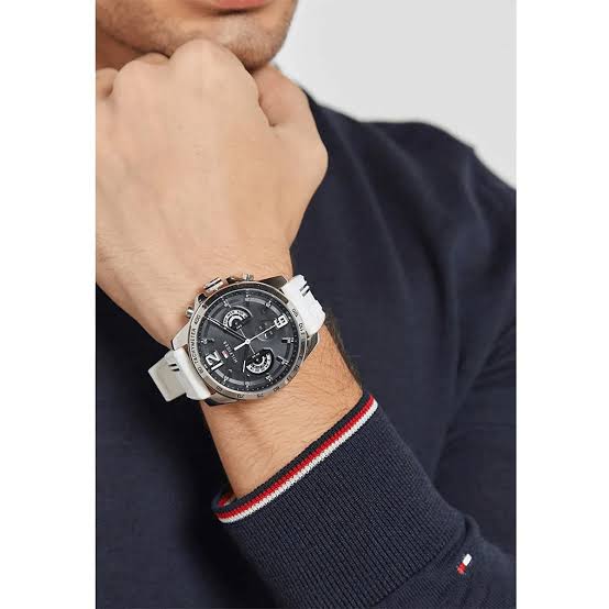 Men's Tommy Hilfiger chronograph watch on wrist with white and blue striped strap
