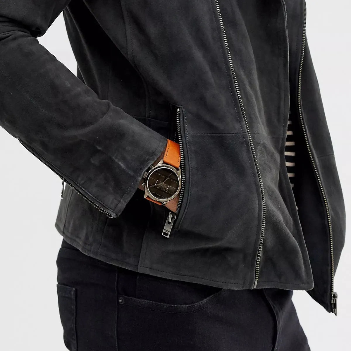 Tommy Hilfiger dual time watch with brown leather strap worn with black jacket