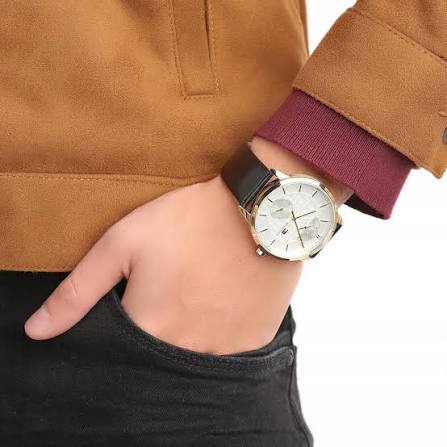 Tommy Hilfiger Hunter watch worn on wrist with white dial and black strap