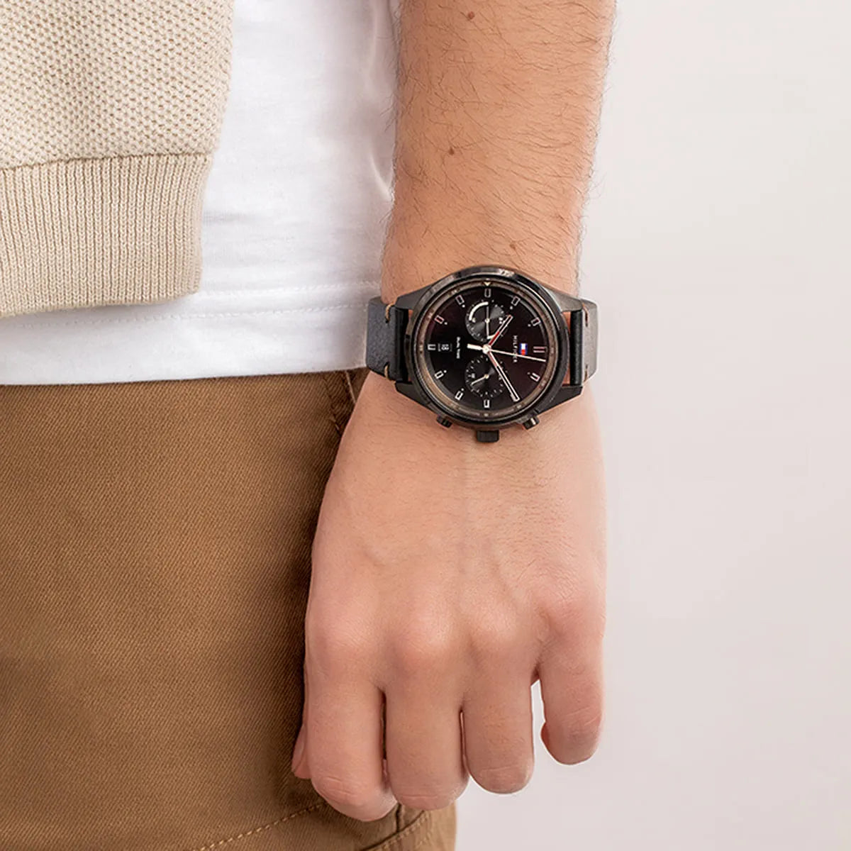 Tommy Hilfiger Bennett black dial watch on wrist with casual outfit styling