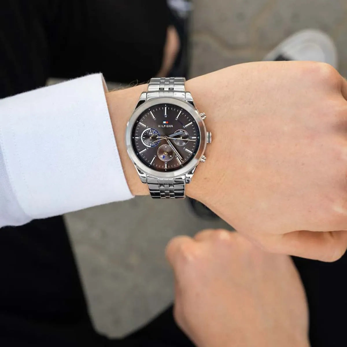 Tommy Hilfiger Ashton chronograph on wrist with white shirt cuff, grey dial visible