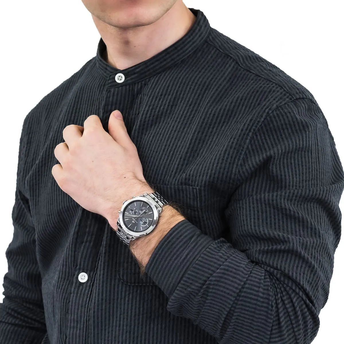 Man wearing Tommy Hilfiger Ashton chronograph on wrist with dark button-up shirt