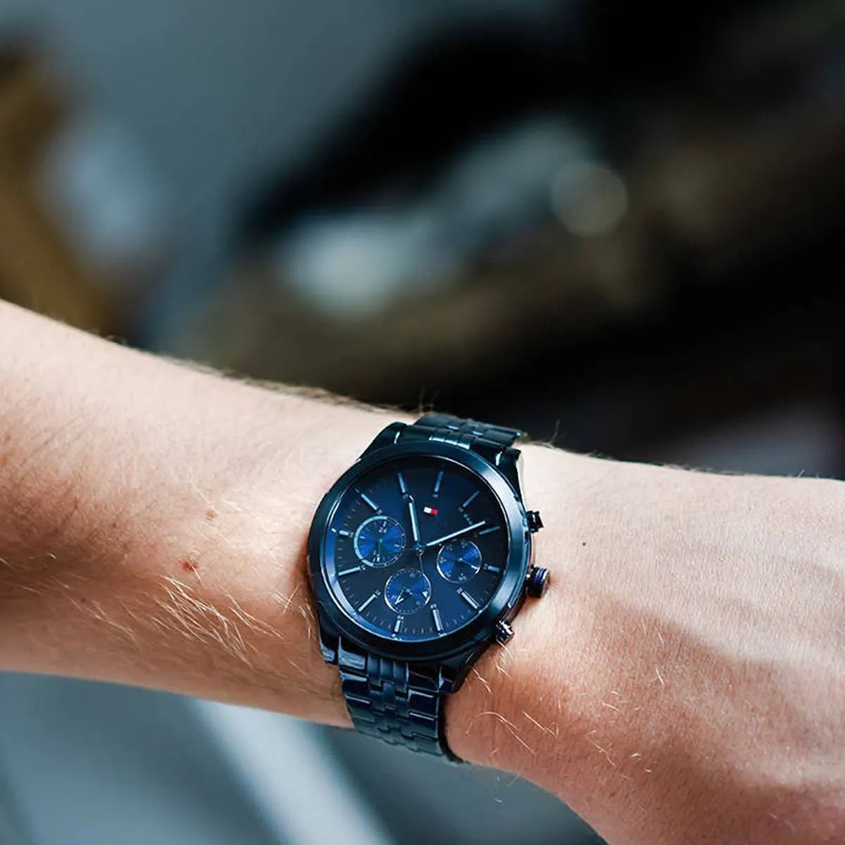 Tommy Hilfiger chronograph watch worn on wrist showing blue dial and chronograph subdials