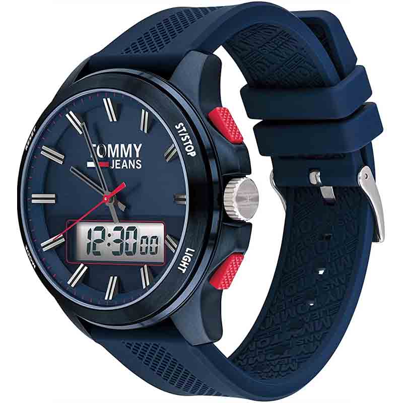 Tommy Hilfiger watch shown at angle with navy silicone strap and red button accents