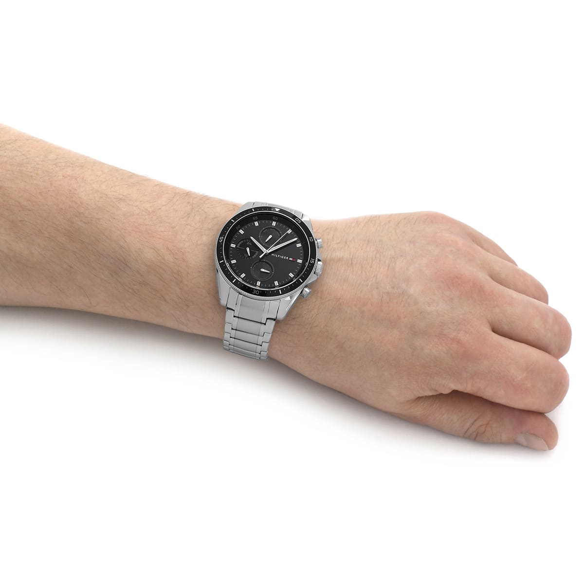 Tommy Hilfiger Parker mens watch worn on wrist with black dial and silver bracelet