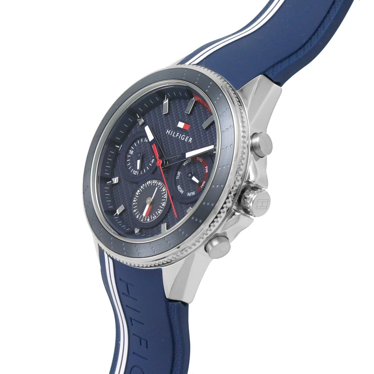 Tommy Hilfiger chronograph watch worn on wrist showing blue strap and dial with red accents