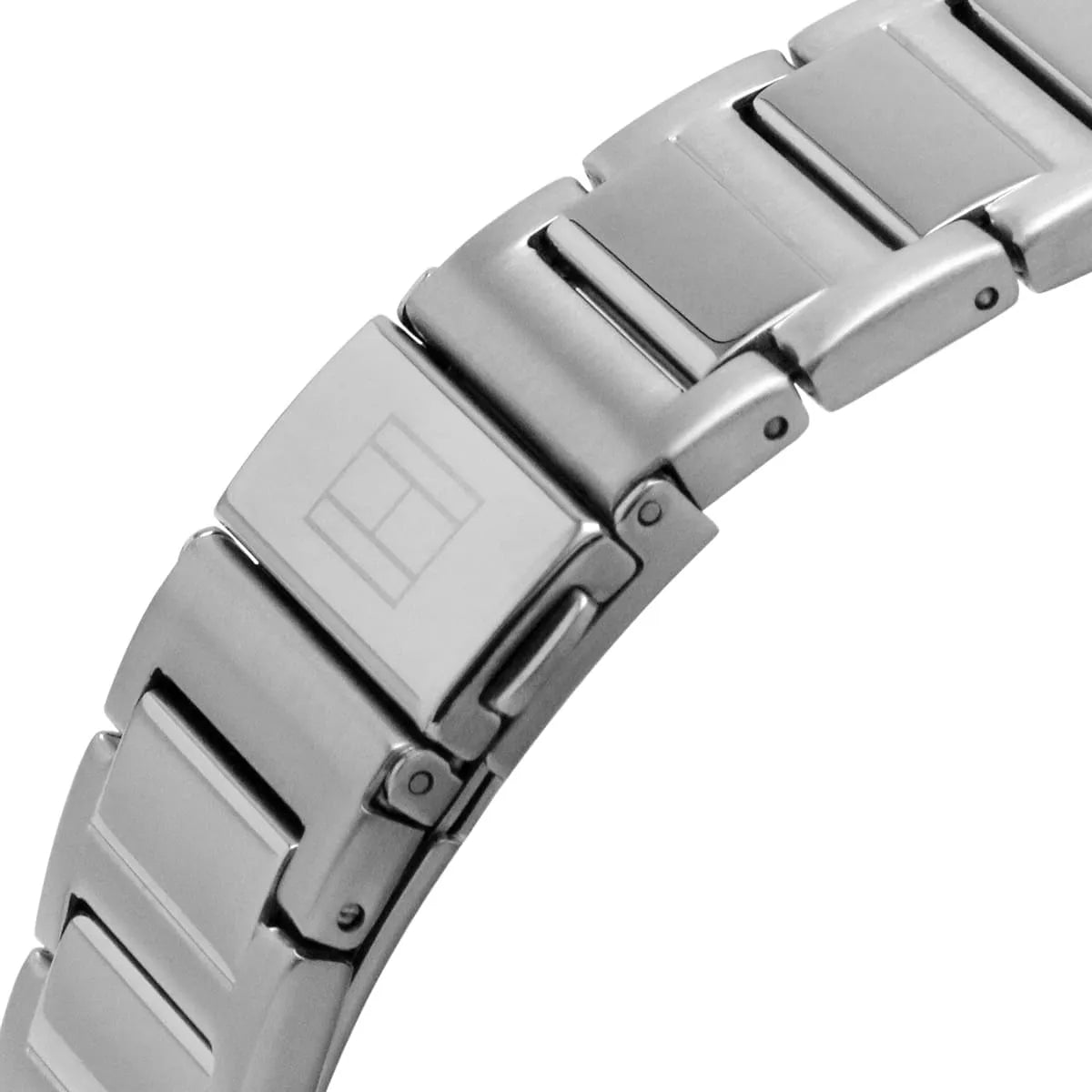 Close-up of silver stainless steel metal bracelet with push-fold clasp on Tommy Hilfiger watch