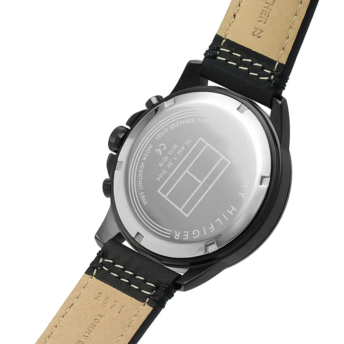 Close-up of Tommy Hilfiger watch caseback with transparent dial and leather strap detail