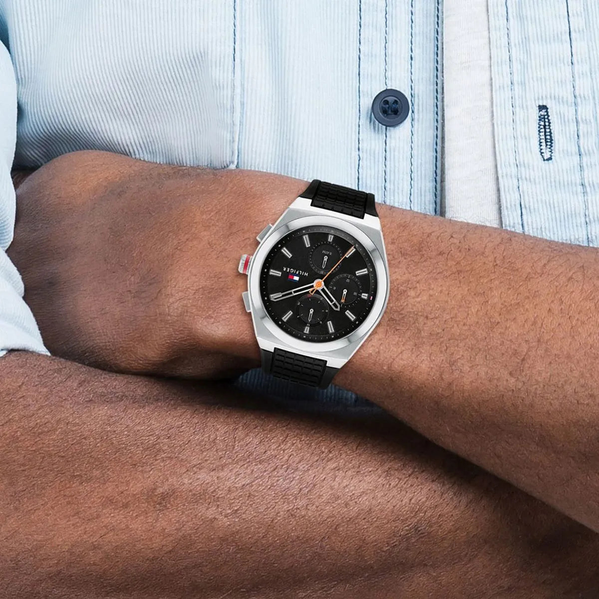 Tommy Hilfiger Connor watch worn on wrist over light blue shirt