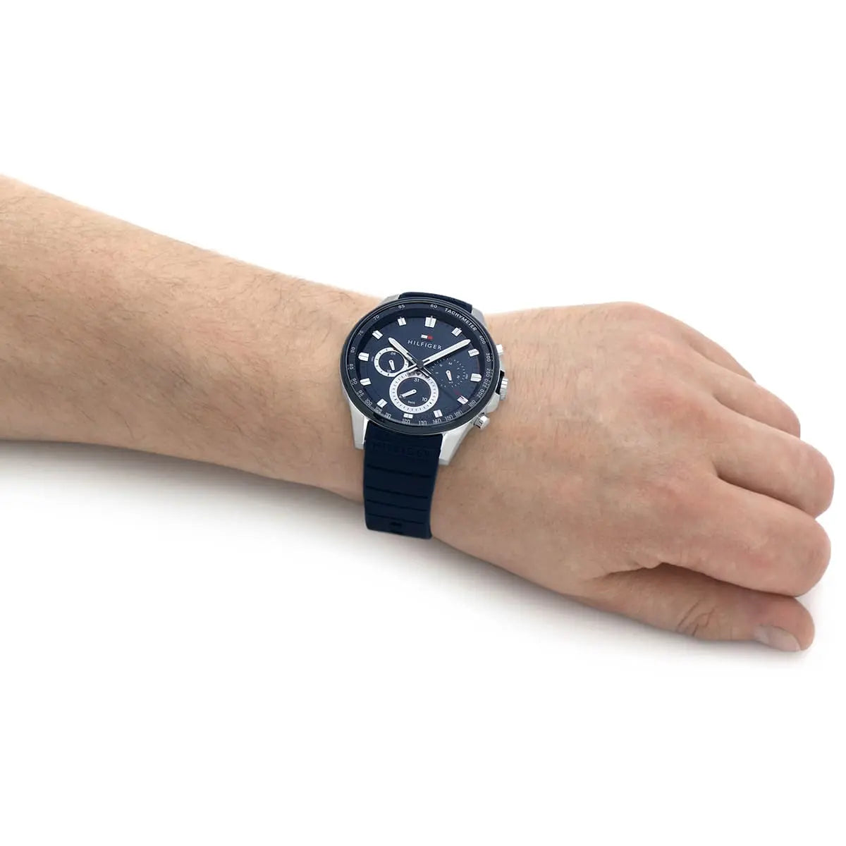 Tommy Hilfiger blue chronograph watch worn on wrist showing full dial and strap
