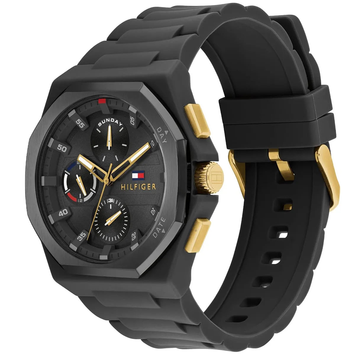 Tommy Hilfiger watch on wrist showing black silicone strap with gold buckle and chronograph dial