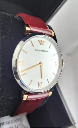 Emporio Armani Luigi AR11061 watch on wrist with burgundy leather strap and silver dial