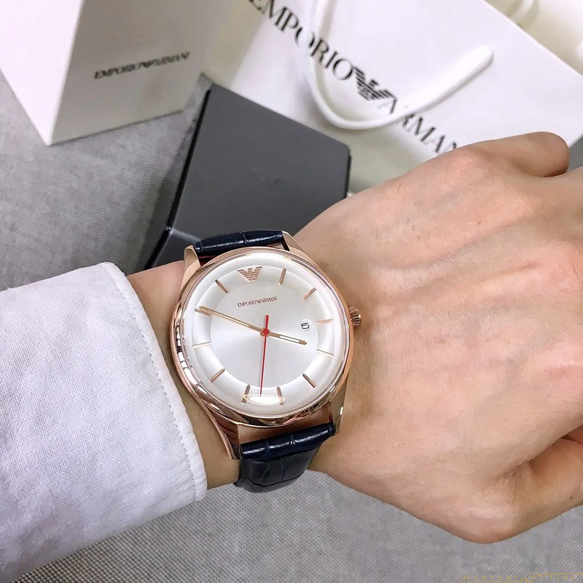 Emporio Armani AR11131 watch worn on wrist with packaging