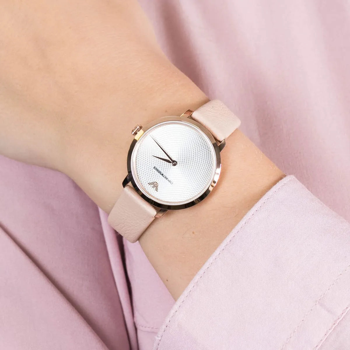 Emporio Armani AR11160 watch on wrist with silver dial and slim rose gold case design