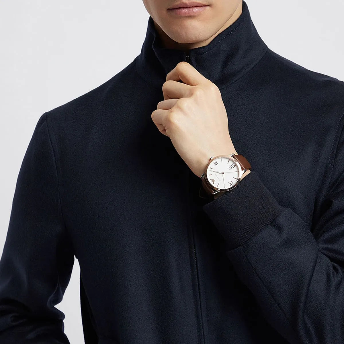 Emporio Armani Giovanni men's watch on wrist showing white dial and rose gold case