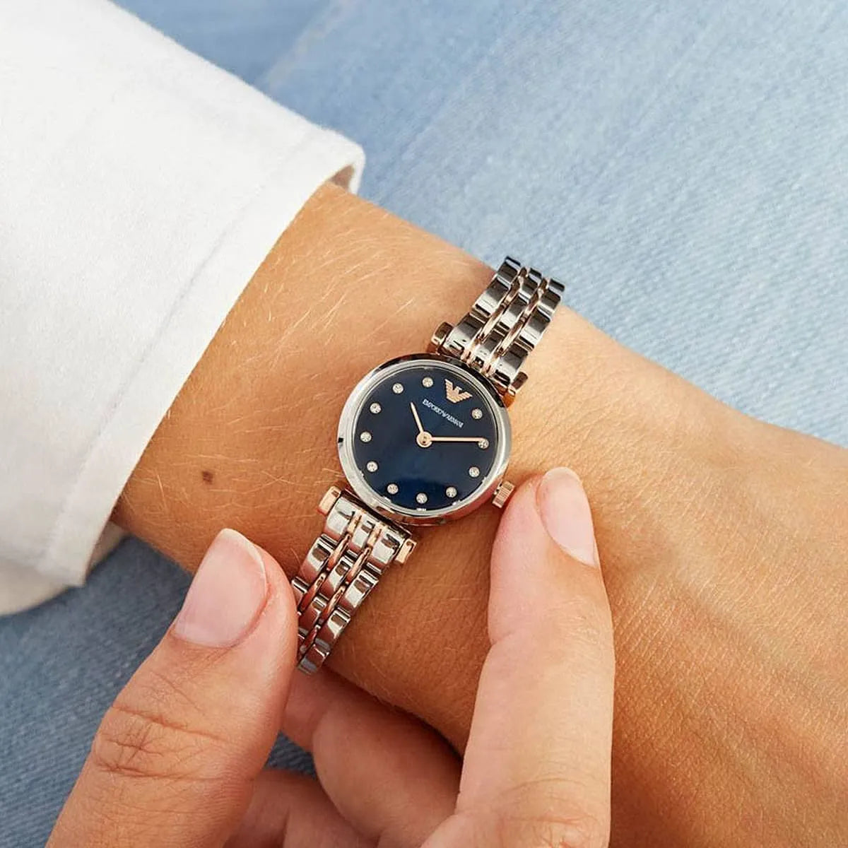 Emporio Armani AR11222 watch on wrist with blue dial and diamond hour markers visible