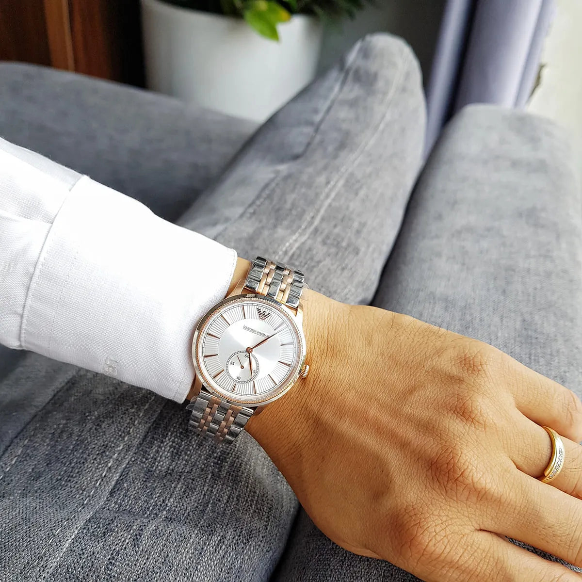 AR1839 Emporio Armani watch worn on wrist showing two-tone steel and rose gold strap