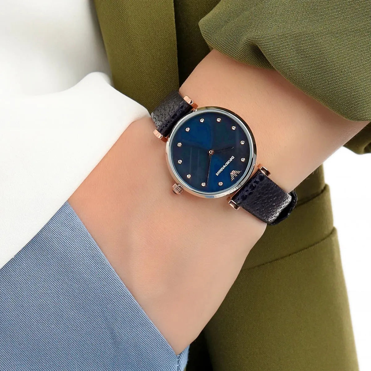 AR1989 Emporio Armani women's watch styled on wrist with green sleeve layering