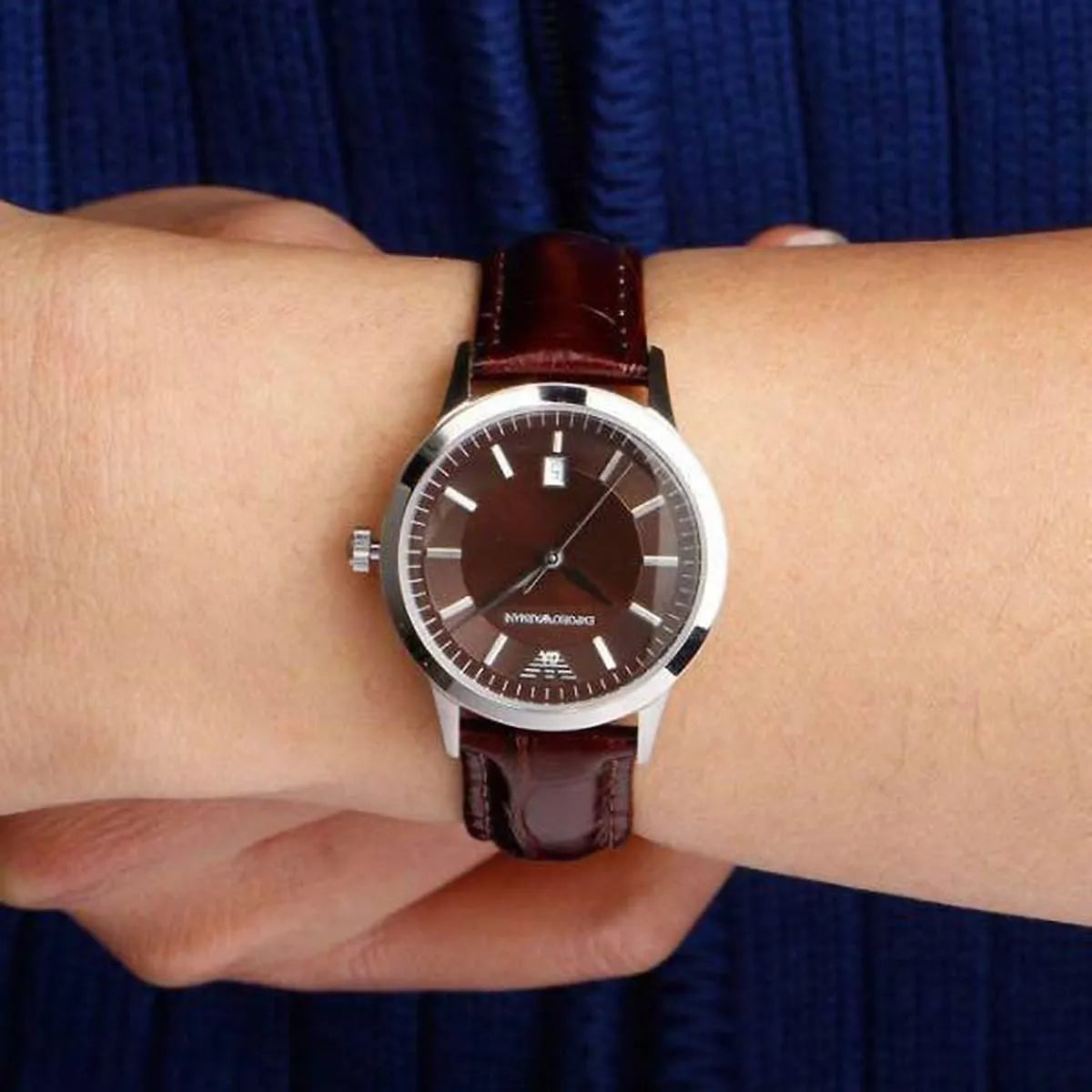 Emporio Armani AR2414 watch on wrist with brown dial and brown leather strap