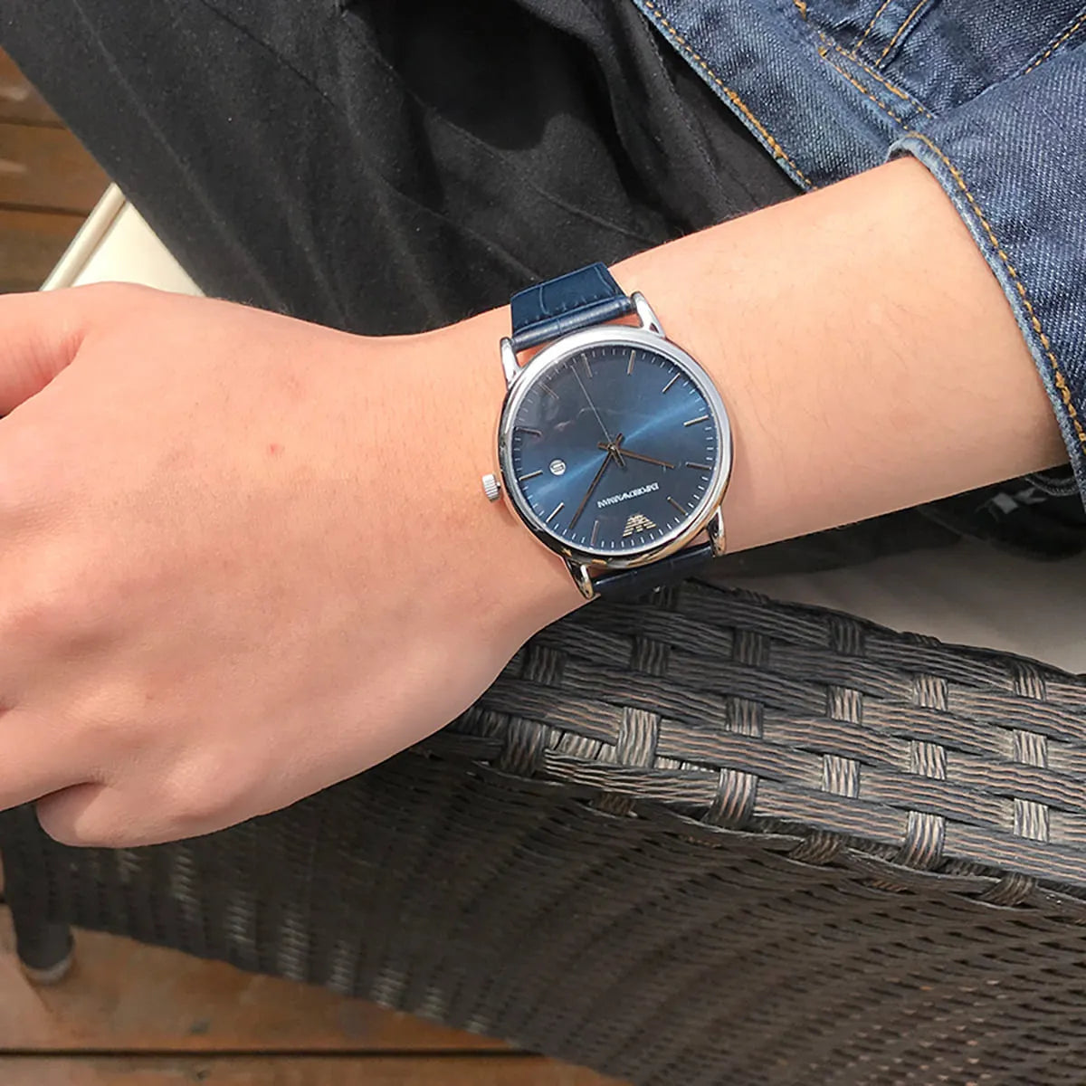 Emporio Armani AR2501 watch worn on wrist showing blue dial and silver case