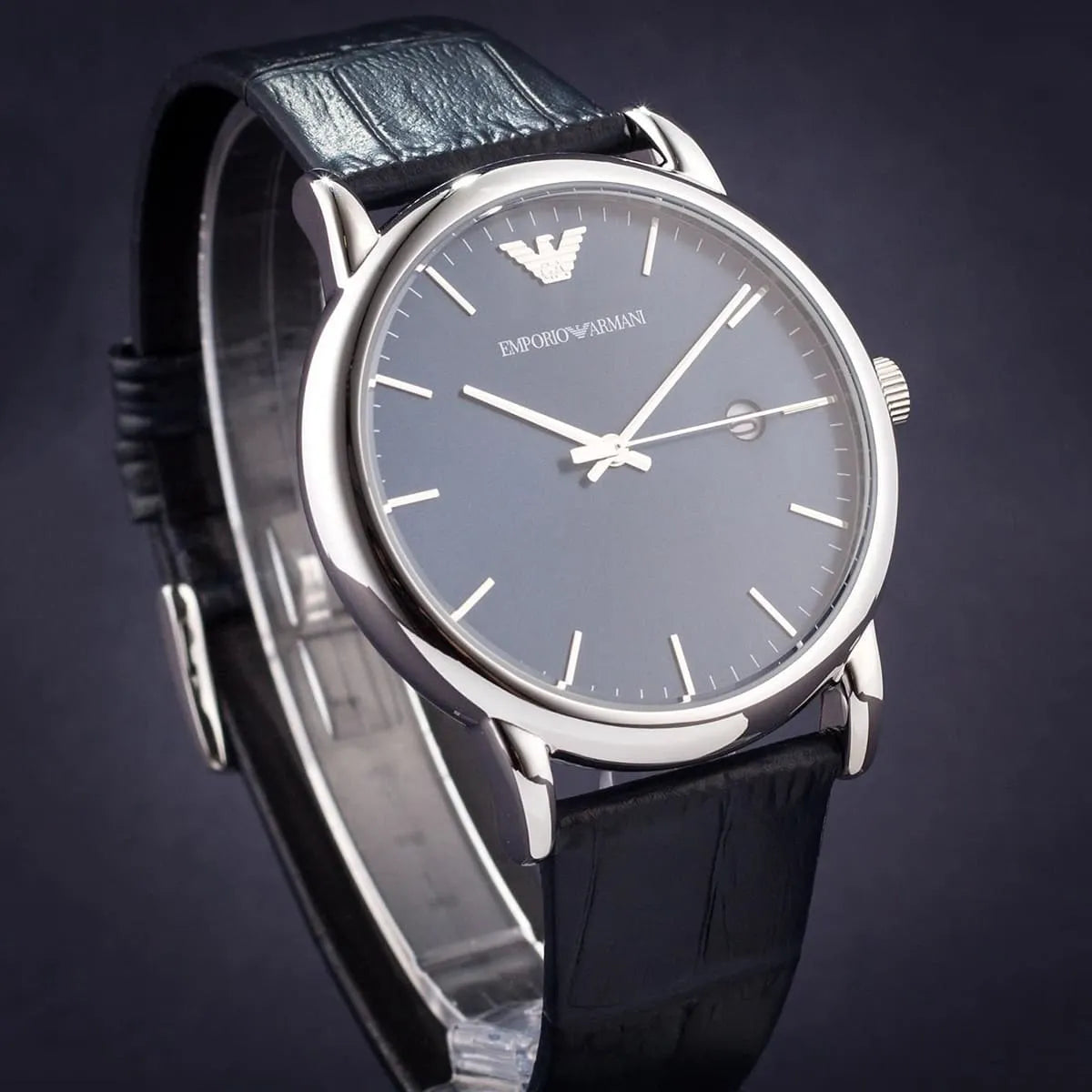 Emporio Armani AR2501 watch with blue dial and leather strap on dark background