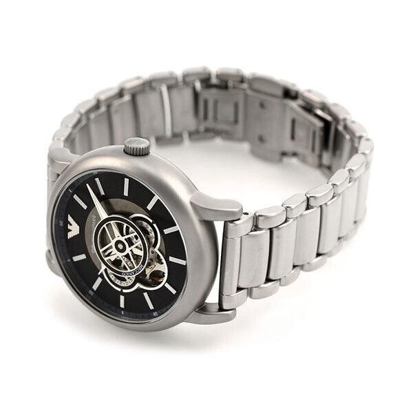 Emporio Armani AR60021 automatic watch worn on wrist showing skeleton dial and silver bracelet