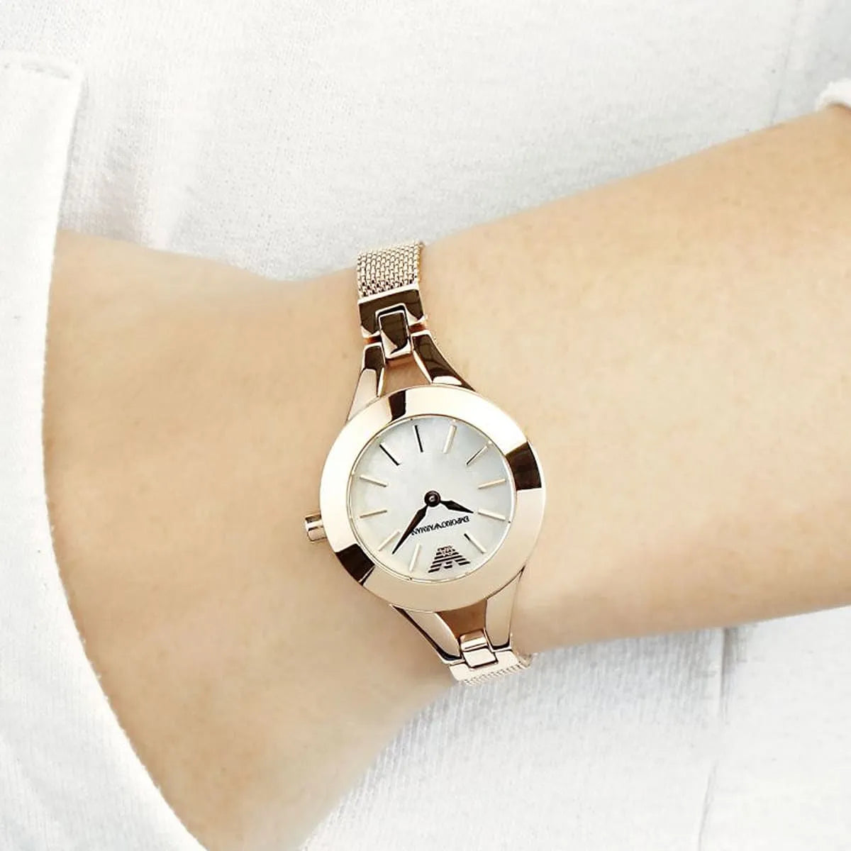 Emporio Armani AR7329 women's watch worn on wrist with rose gold case and mother of pearl dial