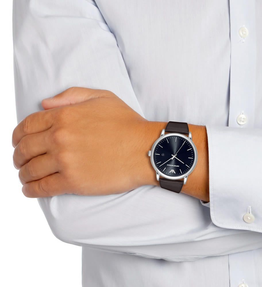 Emporio Armani AR80008 worn on wrist with black dial and brown leather strap against white shirt