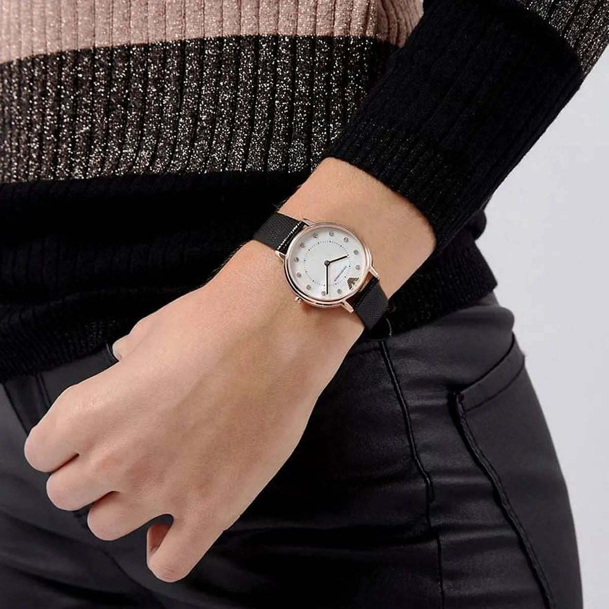 AR80011 ladies watch on wrist with rose gold case and black textile strap