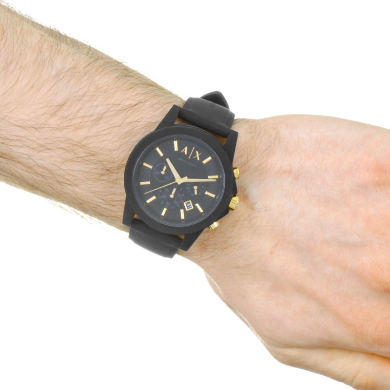 Armani Exchange AX7105 chronograph watch on wrist showing black dial and rubber strap