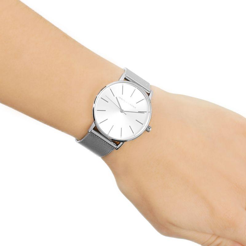 Armani Exchange Three-Hand Lola AX5535 watch worn on wrist with silver mesh bracelet