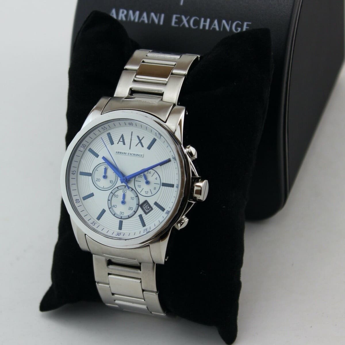 Armani Exchange AX2510 watch with white dial displayed in black branded gift box and sleeve