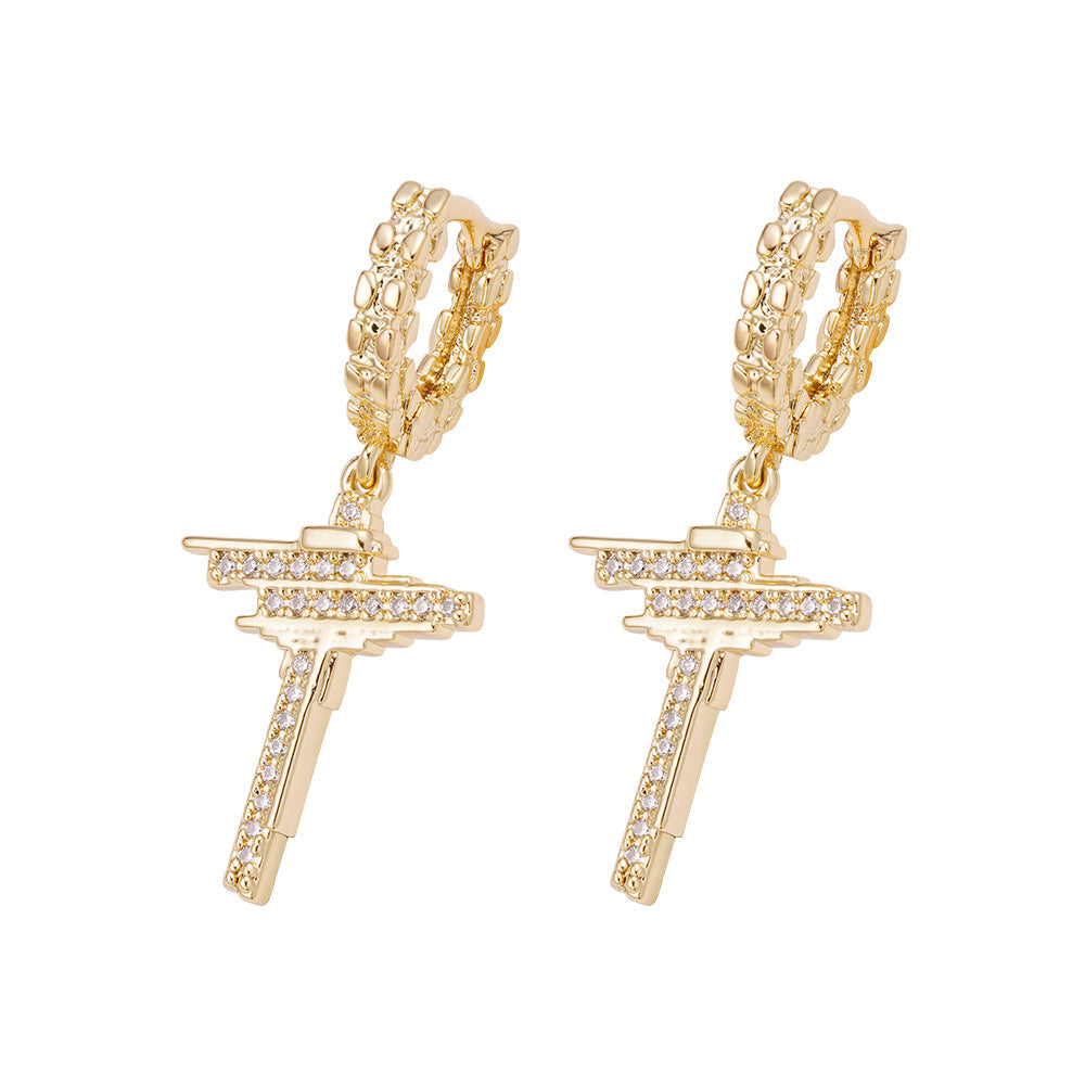 Pair of gold iced out dangle hoop cross earrings with cubic zirconia stones