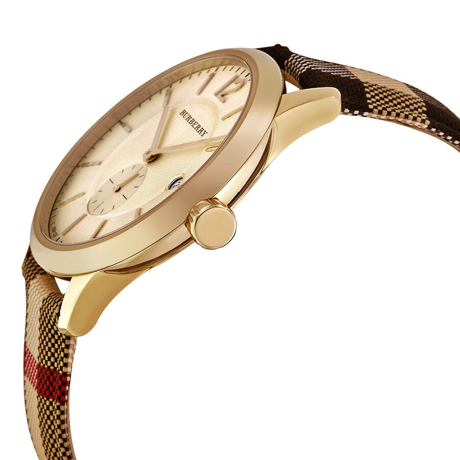 Side angle view of Burberry BU10001 showing honey dial, gold case, and fabric-coated leather strap