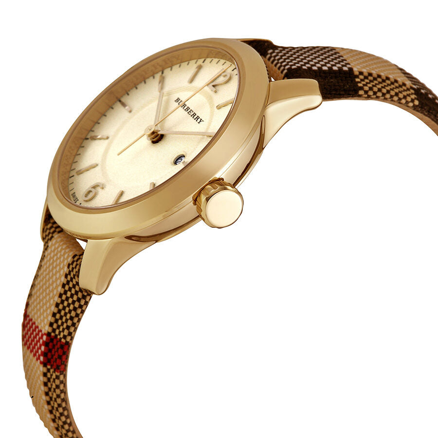 Side angle view of Burberry watch showing cream dial and honey check fabric-coated leather strap