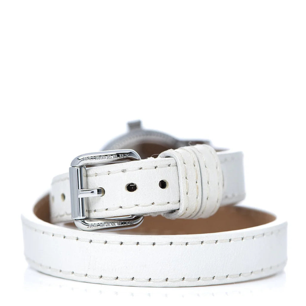 White leather strap with buckle and stud detail, laid flat